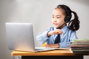 Children wearing Bluetooth earphones during online classes (1)